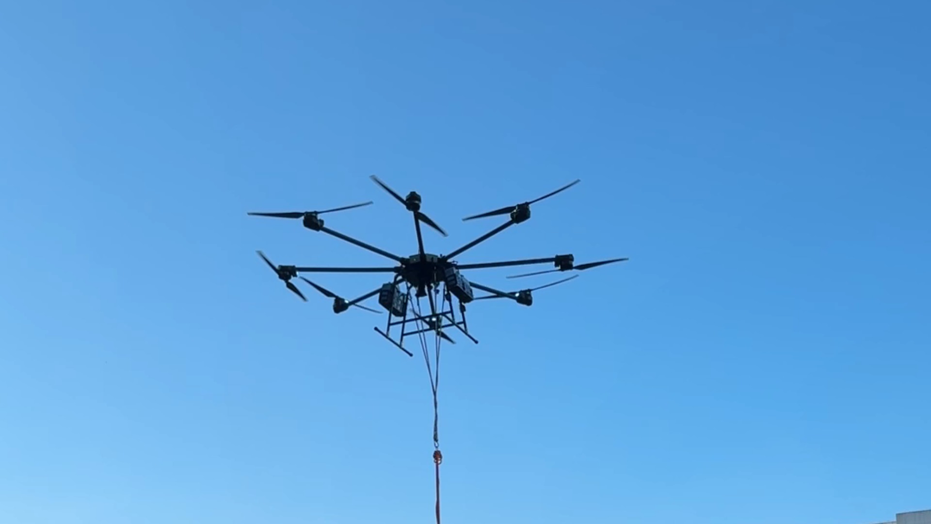 FQ Engine heavy-lift multirotor in flight against a clear sky